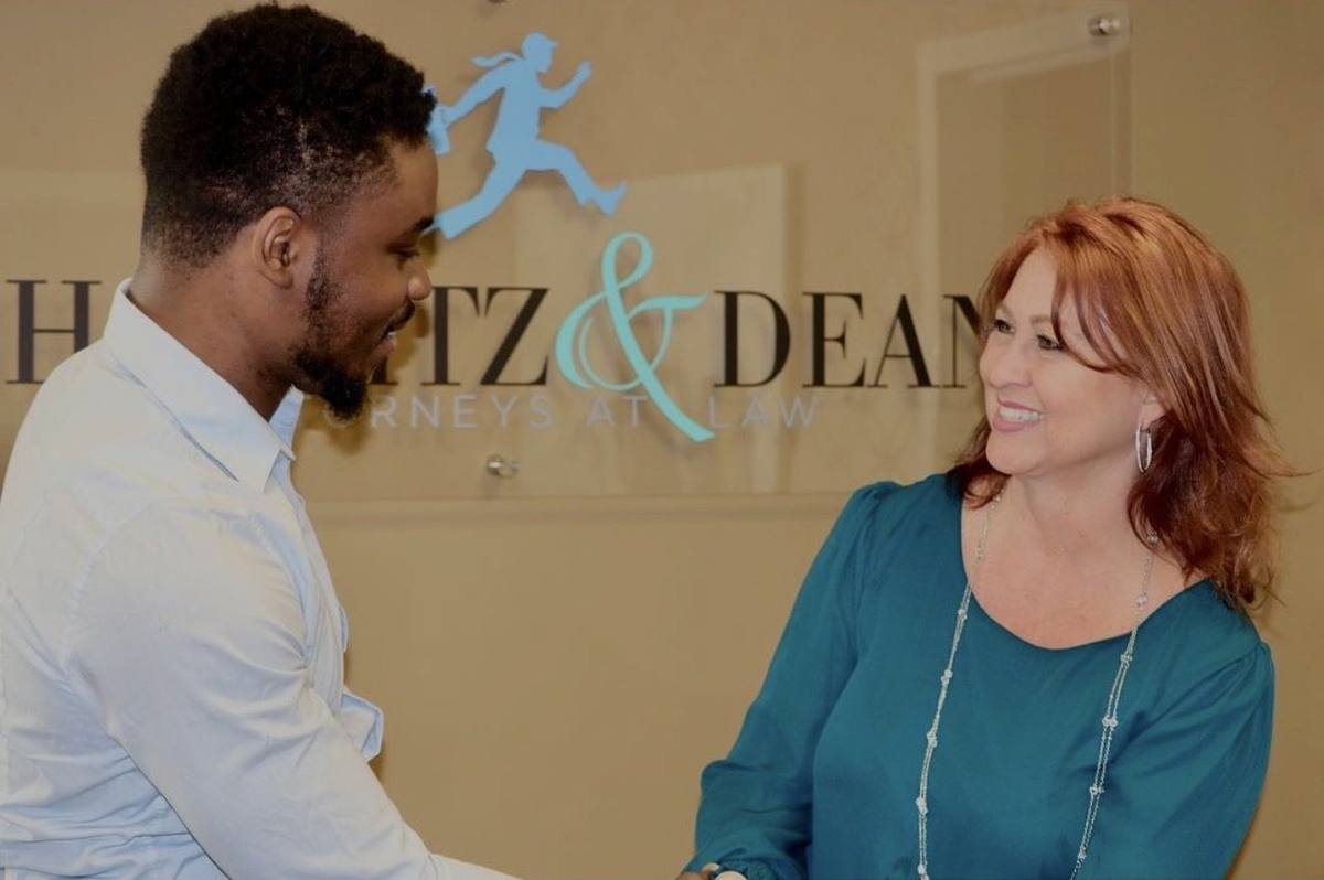 Victor Bomi signing a real estate investment deal